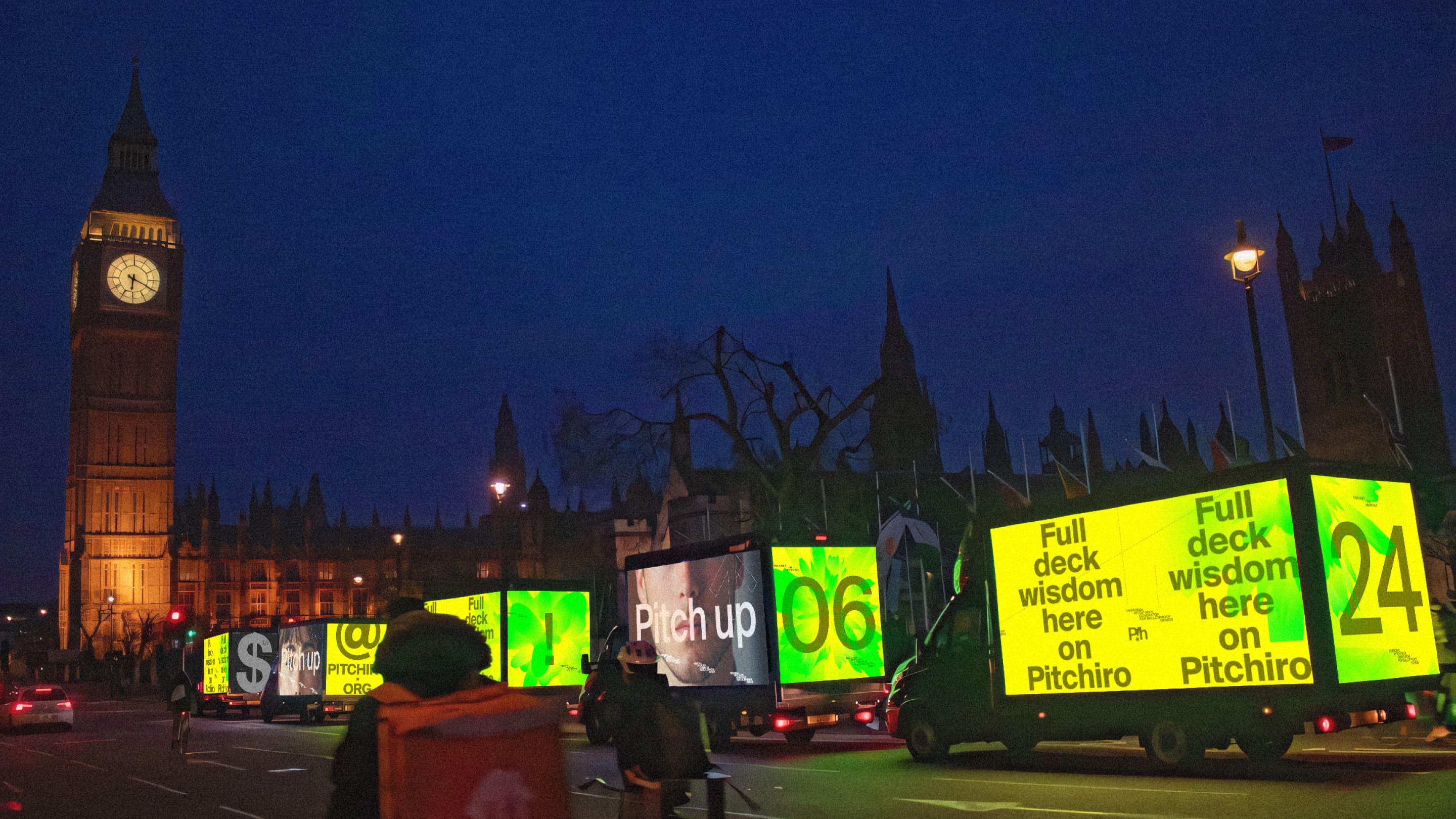Pitchiro billboard trucks driving past Westminster at night